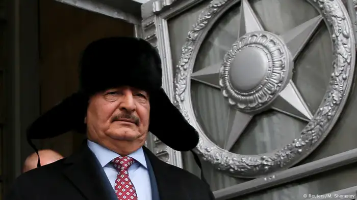 General Khalifa Haftar, commander in the Libyan National Army, wears a Russian hat after a meeting in Moscow