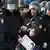 Полиция задерживает участника антикоррупционного митинга в Москве