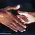 Handshake between people with light and dark skin