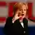 Angela Merkel speaking in Stuttgart with the letters CDU behind her