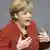 Chancellor Angela Merkel, gesticulating while addressing the Bundestag