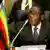 Mugabe and a Zimbabwe sign