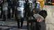 A rioter throws a rock at police near the Parliament building in central Athens on Wednesday, Dec. 10, 2008. A rioter throws a rock at police near the Parliament building in central Athens on Wednesday, Dec. 10, 2008.