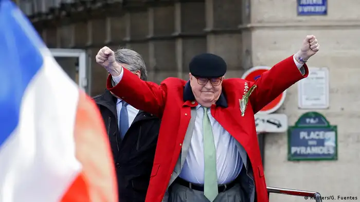 Jean-Marie Le Pen raises two fists in the air while giving a speech in Paris (Reuters/G. Fuentes)
