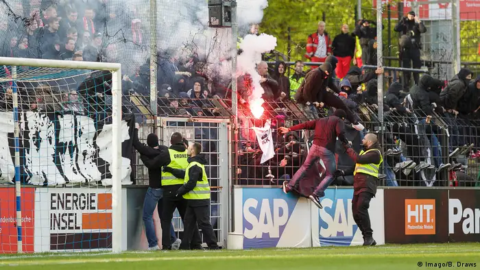Fireworks set off in the crowd at a Cottbus soccer match