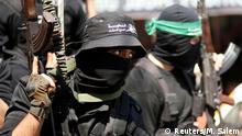 FILE PHOTO: Palestinian members of Hamas' armed wing take part in the funeral of senior militant Mazen Fuqaha in Gaza City March 25, 2017. REUTERS/Mohammed Salem/File Photo