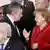 German Chancellor Angela Merkel speaks with British Prime Minister Gordon Brown
