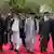Former Afghan President Karzai, Afghan President Ghani, Afghan warlord Hekmatyar, former Jihadi leader Abdul Rabb Rasool Sayyaf and Afghanistan Chief Executive Abdullah walk to attend a ceremony in Kabul