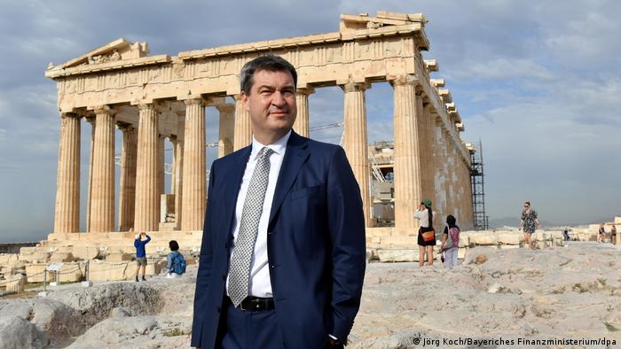 Bavarian Finance Minister Markus Söder standing in front of the Acropolis