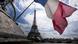 French national flag in front of the Eiffel Tower French national flag in front of the Eiffel Tower