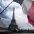 French national flag in front of the Eiffel Tower