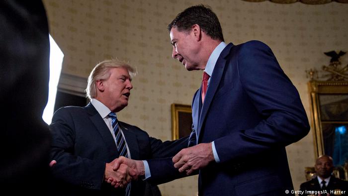 US President Donald Trump and then-FBI Director James Comey shake hands