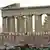 Two banners reading "Resistance" in four languages and "Thursday 18/12 demonstration in all Europe" hanging from the Parthenon