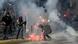 Demonstrators clash with riot police during a protest against the government Demonstrators clash with riot police during a protest against the government