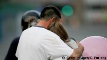 23.05.2017+++ MANCHESTER, ENGLAND - MAY 23: A man embraces a woman and a teenager as he collects them from the Park Inn Hotel where they were given refuge after last nights explosion at the Manchester Arena on May 23, 2017 in Manchester, England. An explosion occurred at Manchester Arena as concert goers were leaving the venue after Ariana Grande had performed. Greater Manchester Police have confirmed 19 fatalities and at least 50 injured. (Photo by Christopher Furlong/Getty Images)