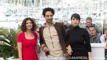 CANNES, May 19, 2017 Director Kaouther Ben Hania (L), actor Ghanem Zrelli (C) and actress Mariam Al Ferjani pose for a photocall of the film ''Alaka Kaf Ifrit'' during the 70th Cannes Film Festival at Palais des Festivals in Cannes, France, on May 19, 2017. gl |