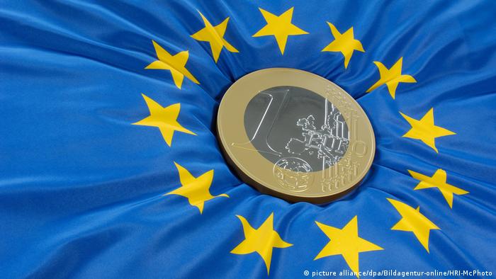 Euro coin on eurozone flag