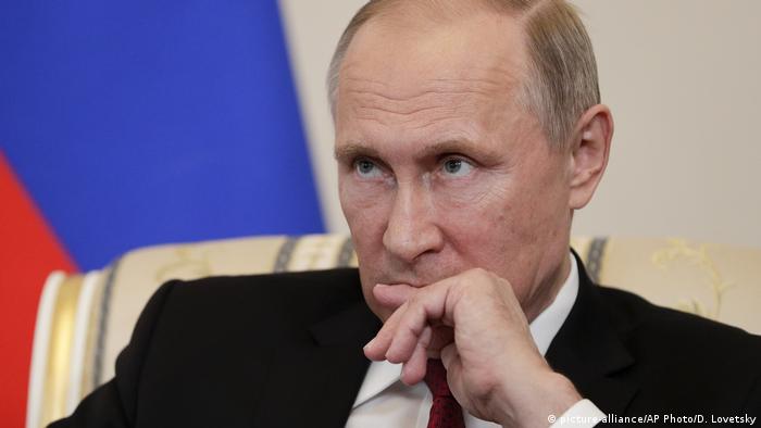 Russian President Vladimir Putin listening