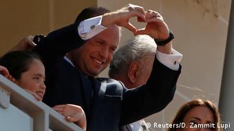 Malta's Prime Minister Joseph Muscat gestures to supporters after his reelection
