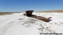 A ruined ship lays on a salinated part of the Aral Sea coastline near the village of Akespe, south-western Kazakhstan, April 16, 2017. Akespe, home to some 250 people, and Karateren, inhabited by about 150, used to be dominated by fishermen until the water receded too far away - but it is now back in Karateren. REUTERS/Shamil Zhumatov SEARCH ENVIRONMENT ARAL FOR THIS STORY. SEARCH WIDER IMAGE FOR ALL STORIES.