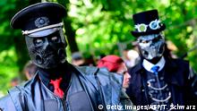Dressed up people attend a so-called Victorian Picnic during the Wave-Gotik-Treffen (WGT) festival in Leipzig, eastern Germany, on June 2, 2017. / AFP PHOTO / TOBIAS SCHWARZ (Photo credit should read TOBIAS SCHWARZ/AFP/Getty Images)