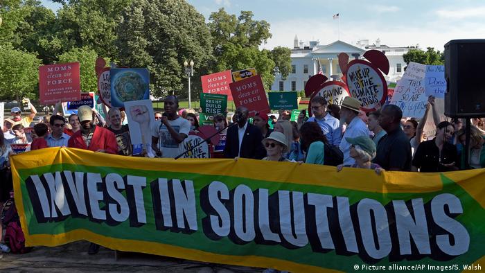 Protesters gather outside the White House in Washington, Thursday, June 1, 2017, to protest President Donald Trump's decision to withdraw the Unites States from the Paris climate change accord