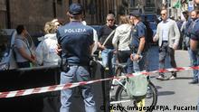 Italian police work on the site where mafia boss Giuseppe Dainotti, 67, was gunned down by two killers while riding his bike police said, on May 22, 2017 in Via d'Ossuna in Palermo, Sicily. / AFP PHOTO / AFP PHOTO AND fucarini / Alessandro FUCARINI (Photo credit should read ALESSANDRO FUCARINI/AFP/Getty Images)