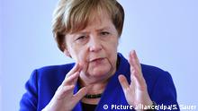 Merkel dispuesta a renegociar acuerdo comercial con EE.UU.