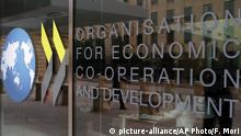 The logo at the entrance of the Organisation for Economic Co-operation and Development (OECD) headquarters in Paris, France, Wednesday, June 7, 2017. (AP Photo/Francois Mori) |
