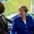 German chancellor Angela Merkel shaking hands with Guinea's president Alpha Conde ahead of the G20 Africa summit last year