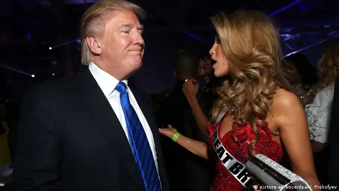 Donald Trump talks with a beauty contestant in Moscow.
