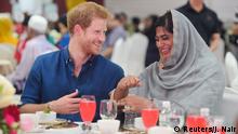 Britain's Prince Harry speaks to Nazhath Faheema, a Muslim Youth Ambassador of Peace, as they eat an evening meal to break fast, or the iftar, for Ramadan - the Muslim fasting month, during a visit to a children's home in Singapore, June 4, 2017. REUTERS/Joseph Nair/Pool TPX IMAGES OF THE DAY