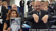 Ensaf Haidar holds a picture of her husband Raif Badawi next to European Parliament president Martin Schulz after accepting the European Parliament's Sakharov human rights prize on behalf of her husband, at the European Parliament in Strasbourg, eastern France, on December 16, 2015. Raif Badawi is a Saudi Arabian blogger and author of a website, detained since 2012 on the charge of breaking Saudi technology laws and insulting religious figures. AFP PHOTO / PATRICK HERTZOG / AFP / PATRICK HERTZOG (Photo credit should read PATRICK HERTZOG/AFP/Getty Images)