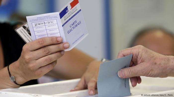 Voting at a polling station in France