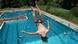 Ein Mann macht einen Salto ins Wasser in einem Schwimmbad in Sachsen. Ein Mann macht einen Salto ins Wasser in einem Schwimmbad in Sachsen.