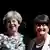 Theresa May e a líder do Partido Unionista Democrático (DUP), Arlene Foster