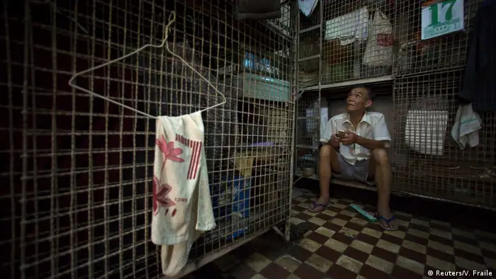 2008: No place to live
Soaring property prices in Hong Kong forced rents higher. By 2008, it wasn't unusual to see people like Kong Siu-kau living in so-called cage homes, 15-square-foot (1.4 square meters) wire mesh cubicles, eight of which were usually crammed into one room. Today an estimated 200,000 people call a wire cage, or a single bed in a shared apartment, home.