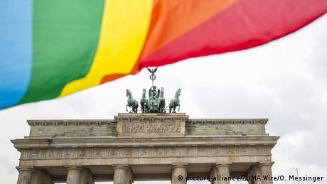A rainbow flag flies over the Brandenburg gate in Berlin