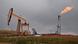 Pump jacks and a gas flare are seen near Williston, North Dakota, on September 6, 2016 Pump jacks and a gas flare are seen near Williston, North Dakota, on September 6, 2016