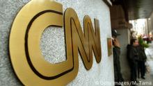 NEW YORK - NOVEMBER 12: The CNN sign is seen outside its headquarters November 12, 2002 in New York City. The proposed merger between CNN and Walt Disney Co.'s ABC News is progressing and could reach an agreement on principle by January, according to negotiators close to the deal. (Photo by Mario Tama/Getty Images) 