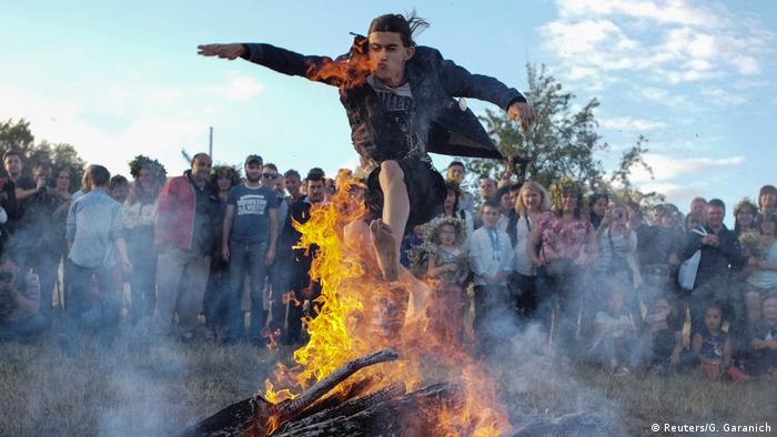 Belarus — a man jumps across a fire / Ivan-Kupala-Day (summer solstice) (Reuters/G. Garanich)