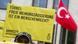 Man holds Amnesty placard urging free speech in Turkey Man holds Amnesty placard urging free speech in Turkey