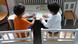 Two children put together puzzles Two children put together puzzles