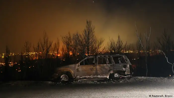Burnt-out car in Croatia (Reuters/A. Bronic)