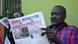A man reading the South Sudanese newspaper 'Juba Monitor' with a frontpage article entitled 'Journalist killed' A man reading the South Sudanese newspaper 'Juba Monitor' with a frontpage article entitled 'Journalist killed'