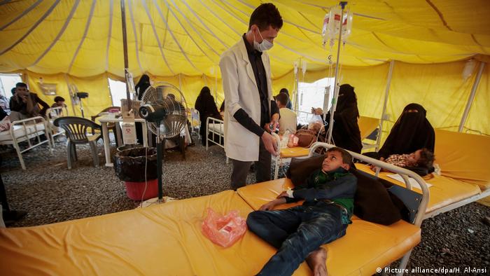 A doctor treats a patient in Yemen
