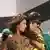Bollywood actors Shah Rukh Khan and Priyanka Chopra embrace in a dance from one of their Bollywood films