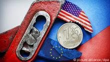 Symbolbild Zange Sanktionen USA EU Russland
