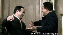 Venezuelan President Hugo Chavez (R) greets Vice President Diosdado Cabello (L) at the Miraflores presidential palace 14 April 2002 in Caracas. Chavez returned to the presidency of Venezuela in a ceremony at the presidential palace 14 April 2002 after a two-day sojourn as a leader ousted in a coup d'Etat. dpa |