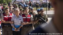 ANKARA, TURKEY - AUGUST 01 : Defendant Akin Ozturk (2nd L) and other defendants arrive for their trial accompanied with gendarmerie commandos of Sincan Penal Institution at Ankara 4th Heavy Penal Court in Ankara, Turkey on August 01, 2017. Members of Fetullah Terrorist Organization (FETO) 486 defendants are taken to court due to using Akinci Air Base which they used as their headquarters, during the night of July 15, 2016 defeated coup attempt. Mustafa KamacÄ± / Anadolu Agency |